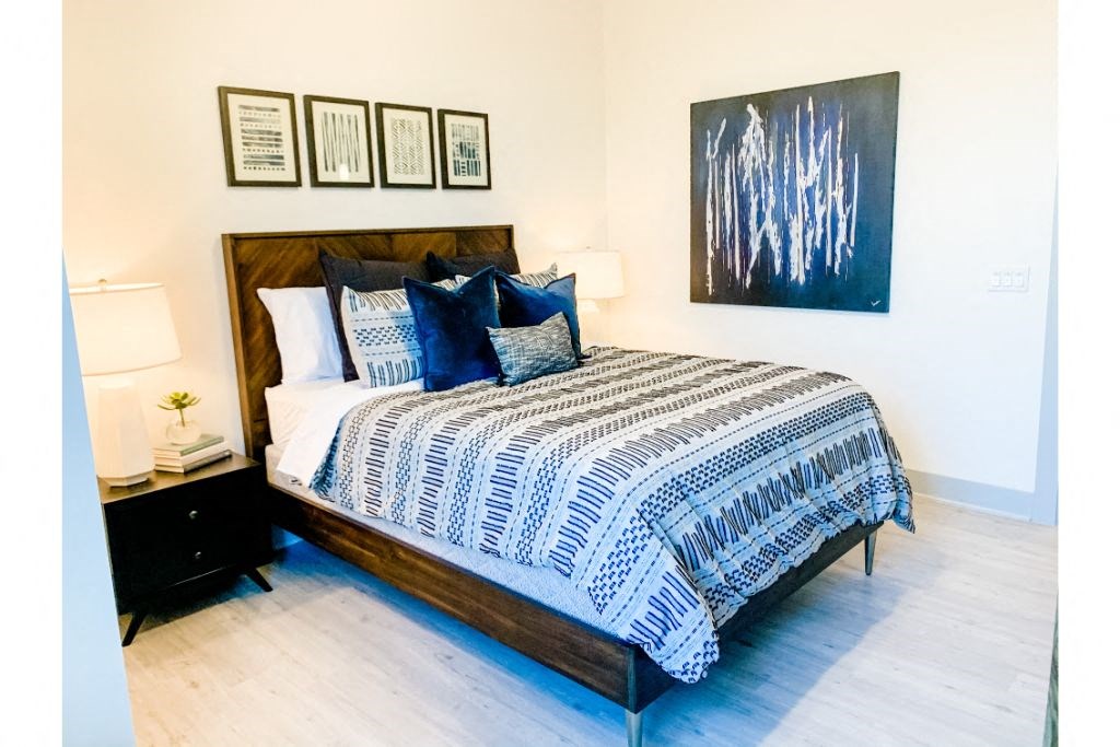 a bedroom with a bed and a nightstand