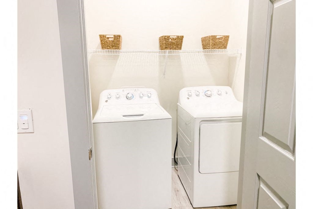 a small laundry room with a washer and dryer
