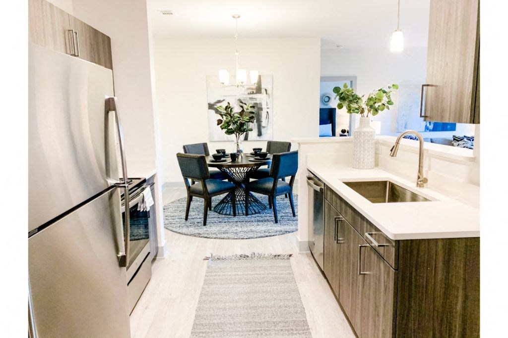 a kitchen and dining area in a 555 waverly unit