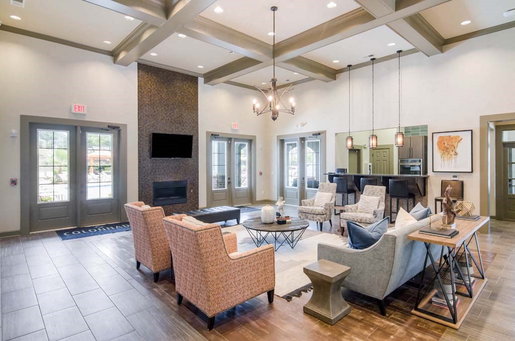 a living room filled with furniture and a fire place