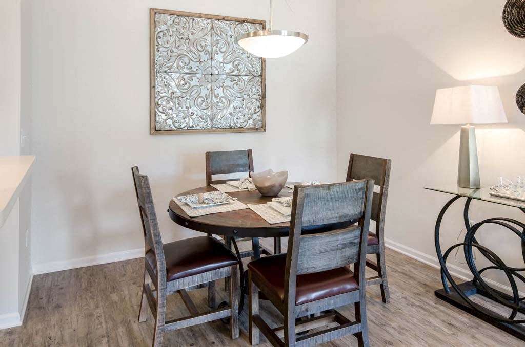 a dining room with a table and chairs