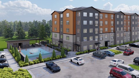 A large apartment complex with a pool and cars parked in the driveway.