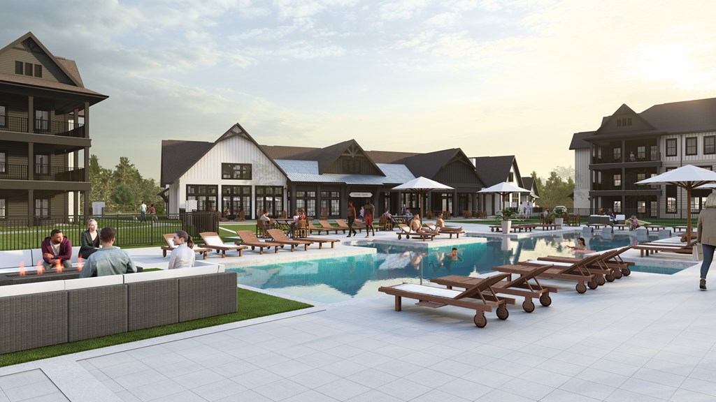 A group of people are sitting by a pool in a resort.