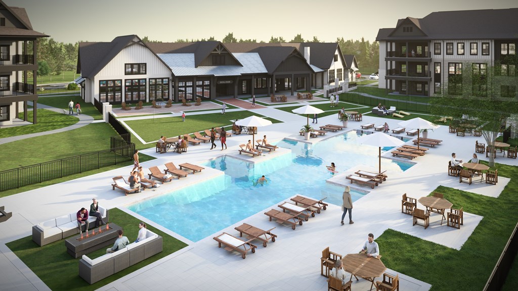 A large outdoor pool area with people enjoying the sun and water.