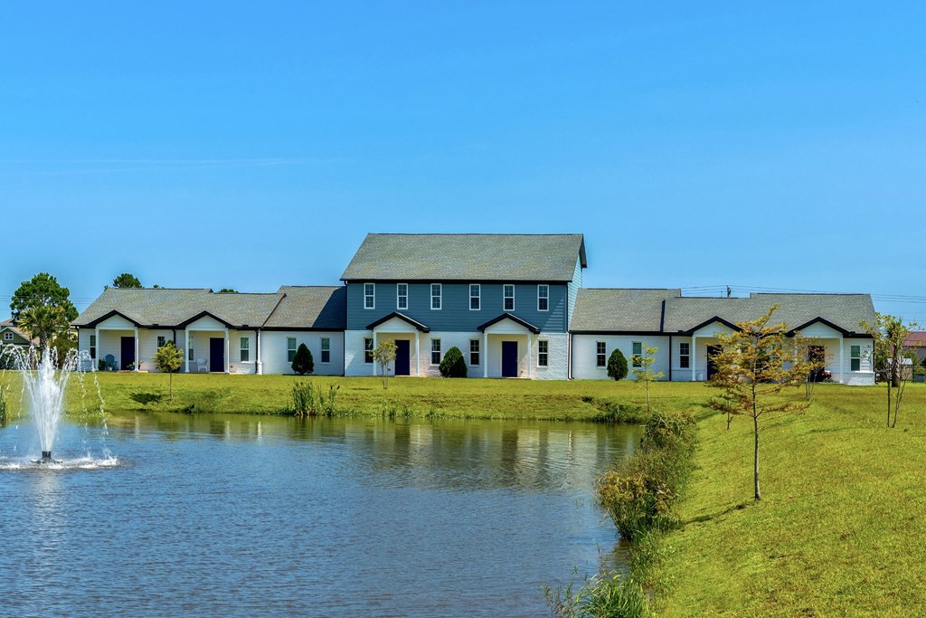 a large pond in front of a house