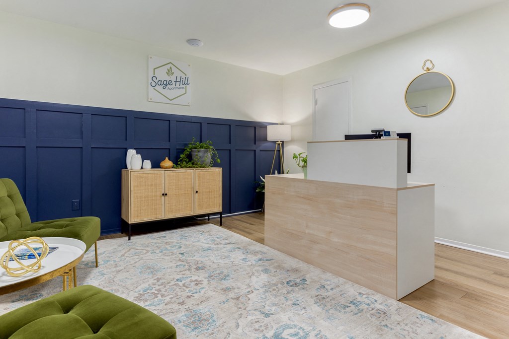 a living room with a blue and white rug and a reception desk
