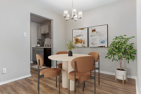 a dining room with a table and chairs