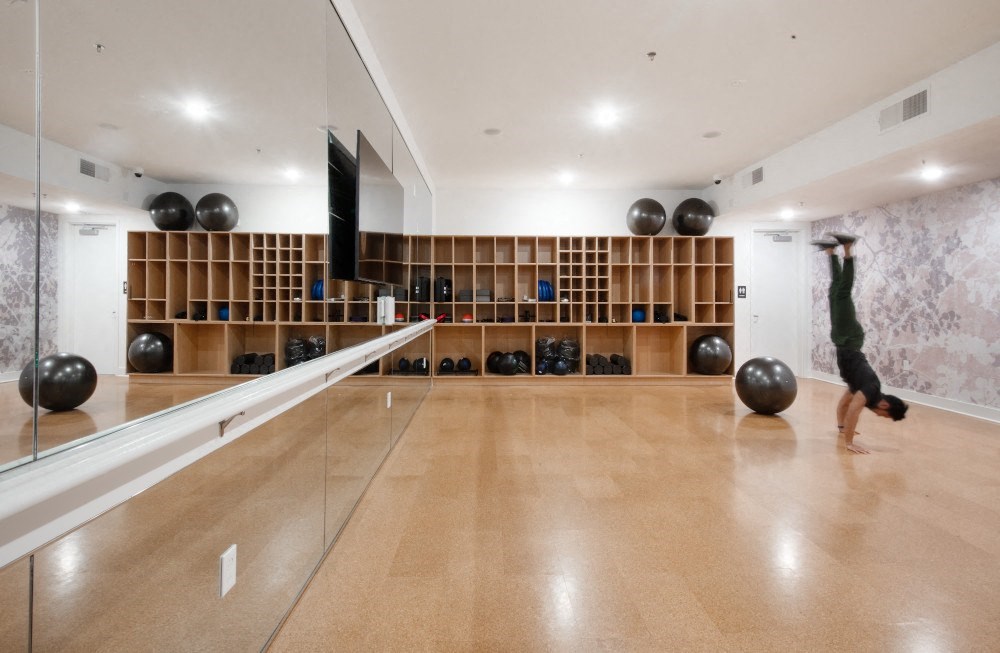 a bowling alley in a gym with a person doing a trick on a bowling ball at 20 Midtown, Alabama, 35233