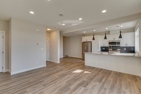 A kitchen area with a countertop and cabinets.