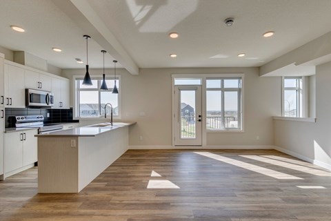 A kitchen with a counter and a microwave.