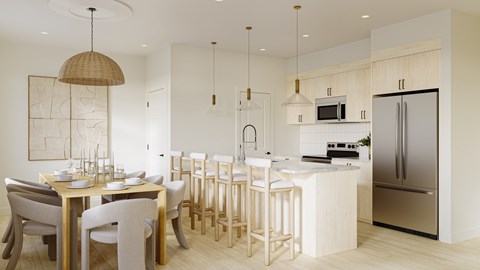 A modern kitchen with a dining table and chairs.