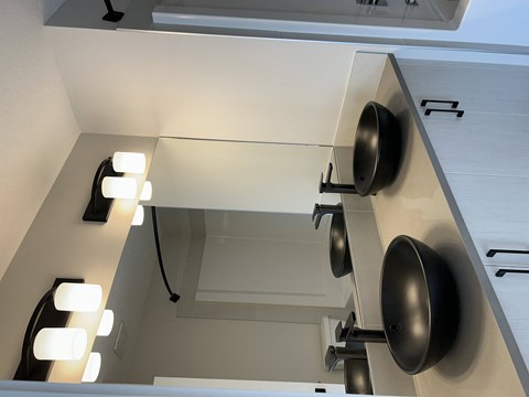 a kitchen with a counter top with pots and pans