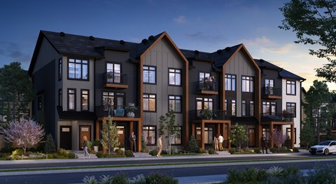 A modern apartment complex with balconies and multiple stories.