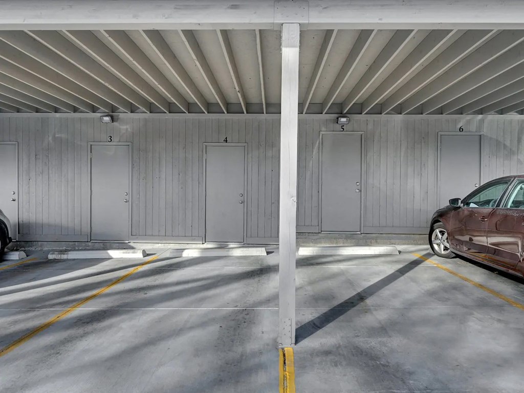 a car parked in a parking garage with doors