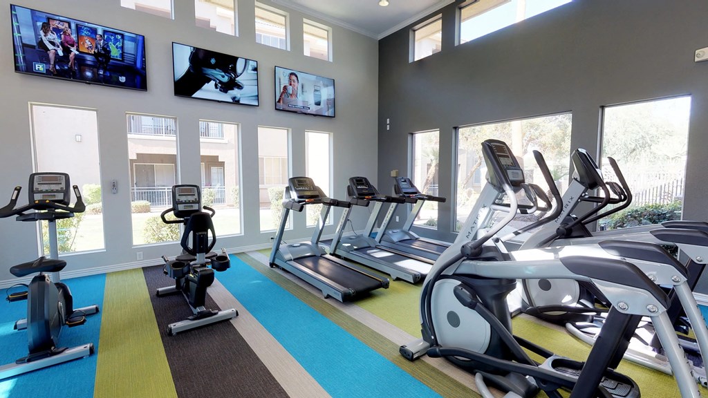 Well equipped fitness center with treadmills, elliptical machines, stationary bikes, and large TV's at SKY at p83, Peoria, Arizona 85381