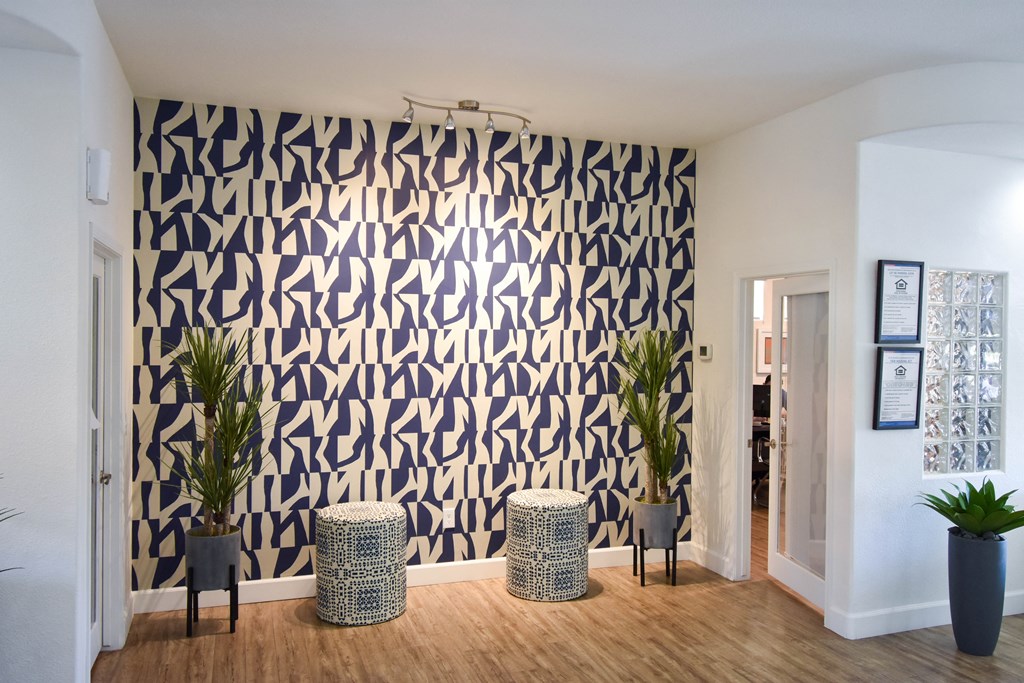 Navy Blue and Ivory Wall with trendy modern stools outside of leasing office