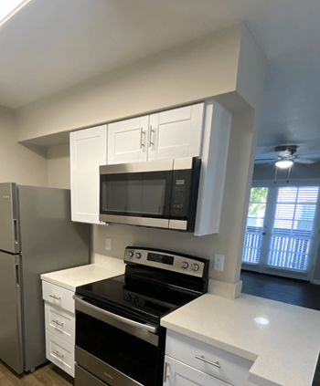 Kitchen with Full Sized Microwave at Stonebridge Apartments in Phoenix, AZ