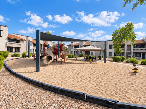 Childrens playground with shade structure and sand area at Gentrys Walk Apartments, Mesa, 85204