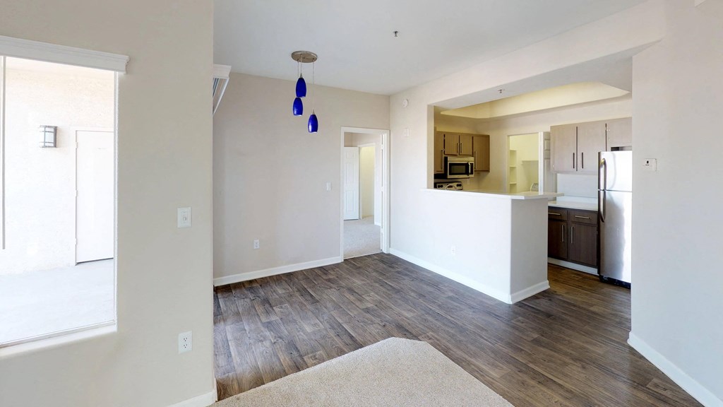 Open view of dining area and kitchen in 2x1 apartment