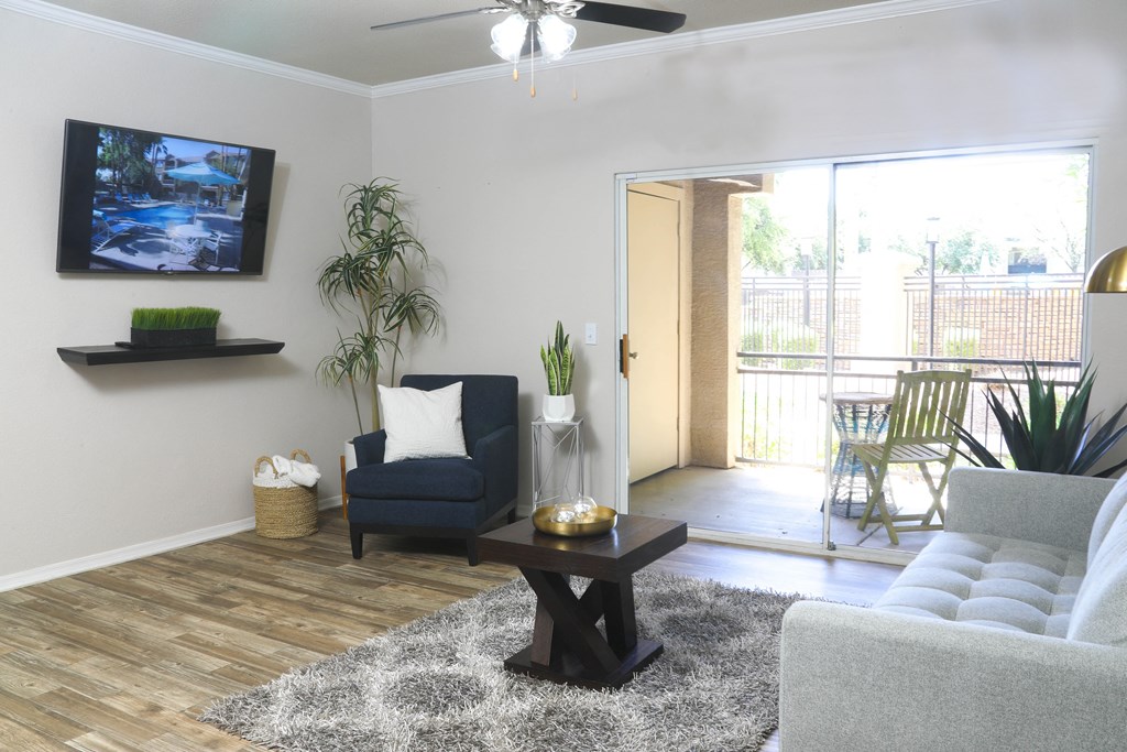 a living room with a couch and a coffee table and a tv at Sky at P83, Peoria, AZ, 85381