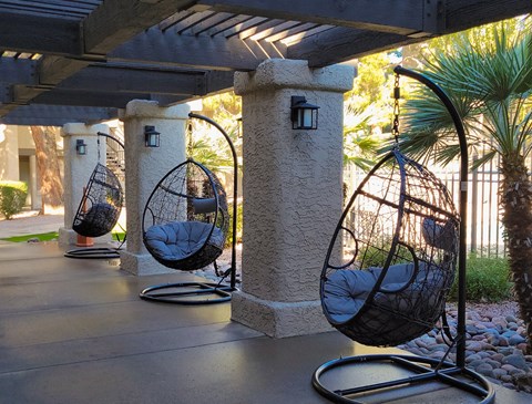 swing chairs by pool area