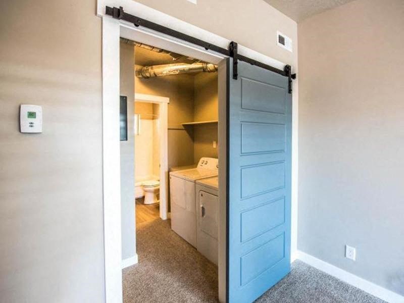 a bathroom with a blue sliding door