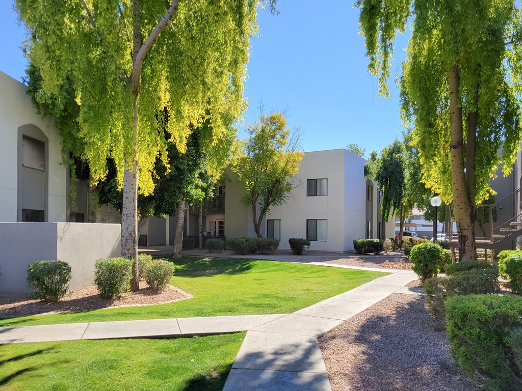 Lush green grass in between buildings at Stonebridge, Phoenix