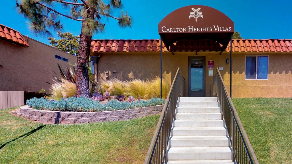 Stairs leading up to front door of leasing office