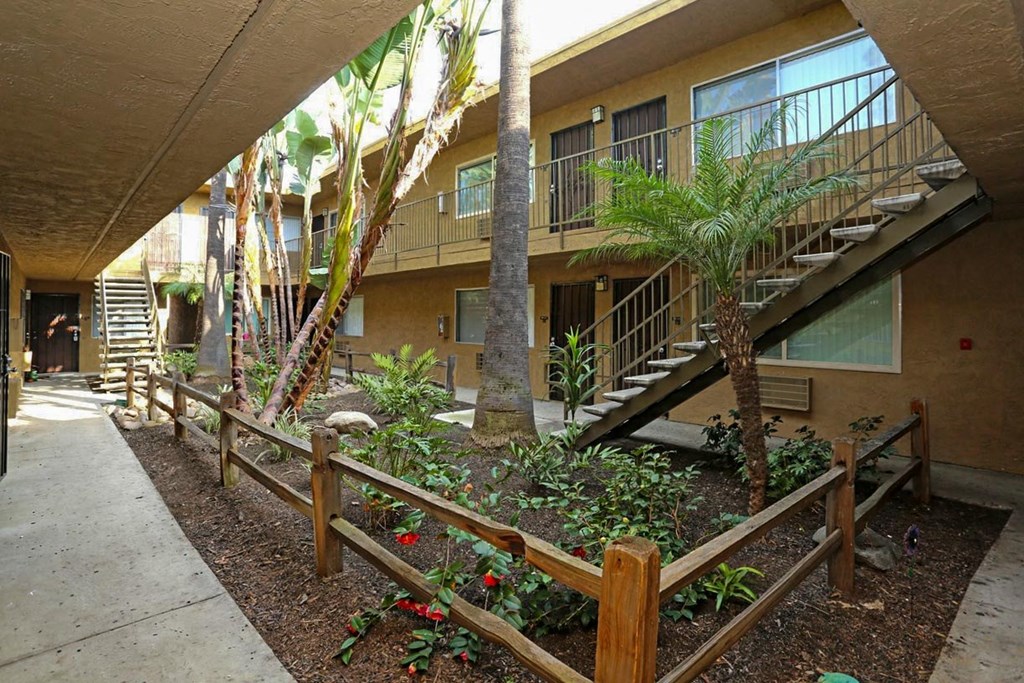 Garden style courtyard with lush matured landscaping in the center of apartment buildings