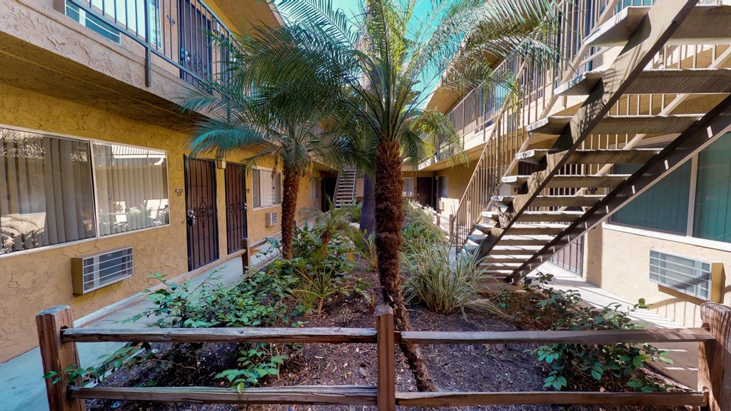 Garden style courtyard with lush matured landscaping in the center of apartment buildings