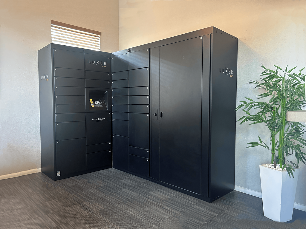 A LUXER branded storage unit is in a room with a plant.