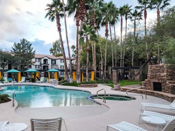 Resort Style Pool with Hot Tub surrounded by palm trees at SKY at p83, Arizona