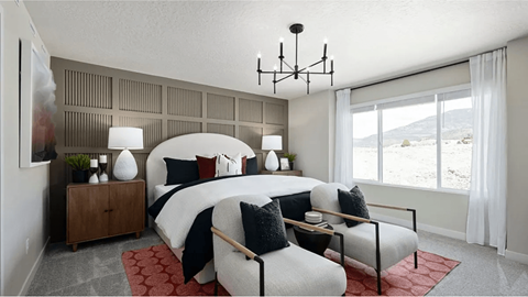 A bedroom with a large bed and a view of the outdoors through a window.