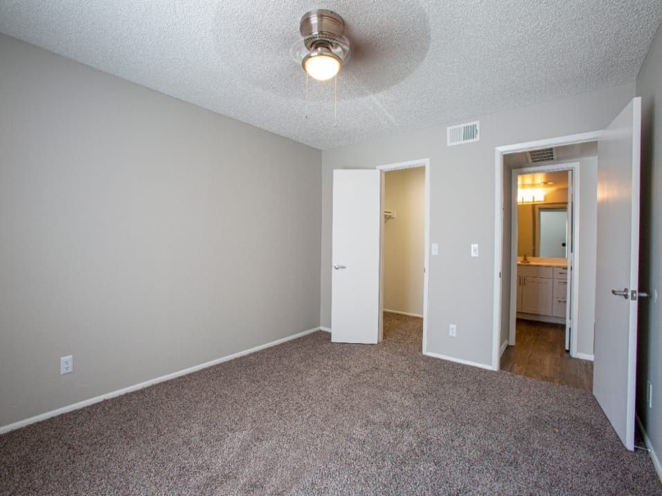 Cozy Bedroom with Plush Carpet and Ceiling Fan at Enclave at Paradise Valley, AZ 85032