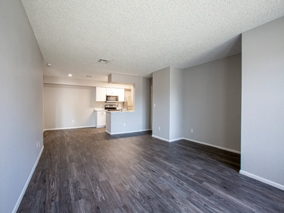 Living Room Space with Grey Wall and Plank Flooring Drenched in Natural Light at Enclave at Paradise Valley, Phoenix