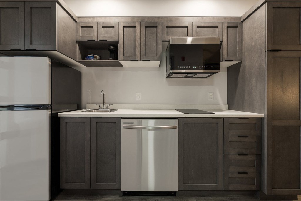 a kitchen with a sink and a refrigerator