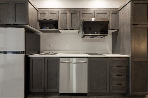 a kitchen with a sink and a refrigerator