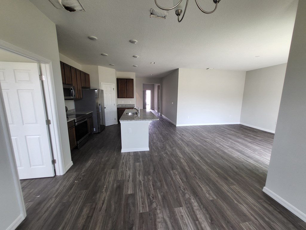 an open floor plan with a kitchen and living room