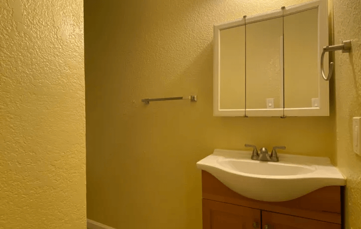 a bathroom with a sink and a medicine cabinet