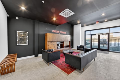 A modern office space with a reception desk and a framed sign on the wall.