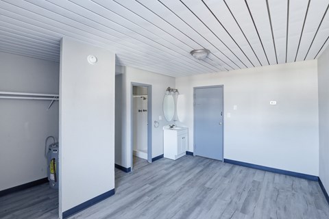 A room with a grey floor and white walls.