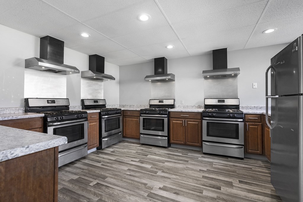 a kitchen with stainless steel appliances and wooden cabinets