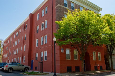 a red brick building on the corner of a street