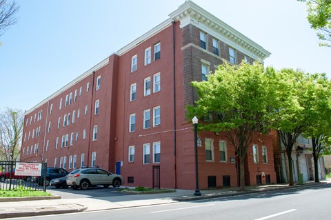 a red brick building on the corner of a city street