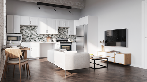 A modern kitchen with white cabinets and a wooden island.