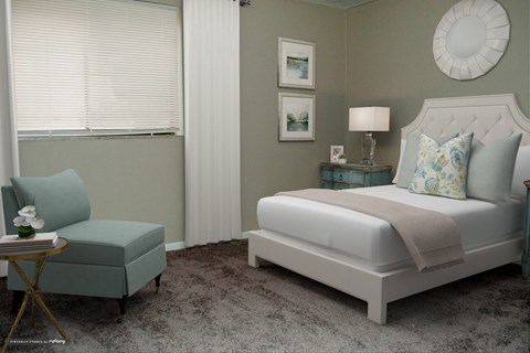 A bedroom with a large bed and a small chair.