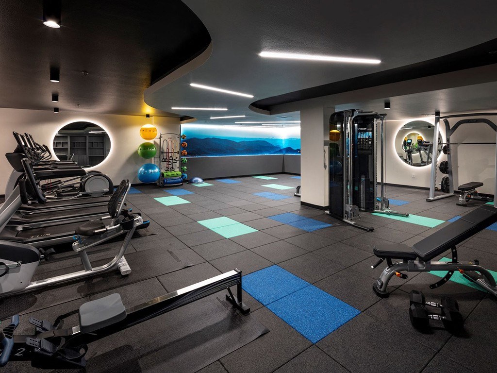 a gym with a view of the mountains in the background