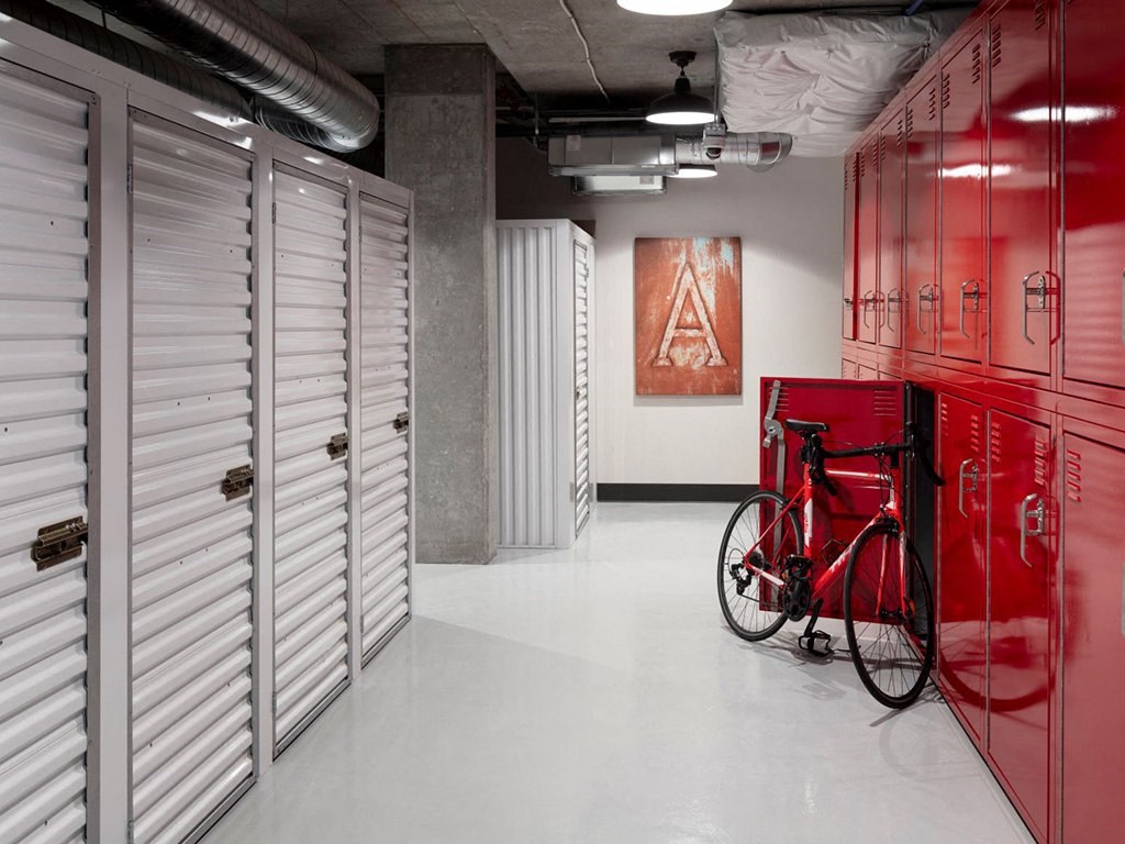 a bike parked in a room with several lockers