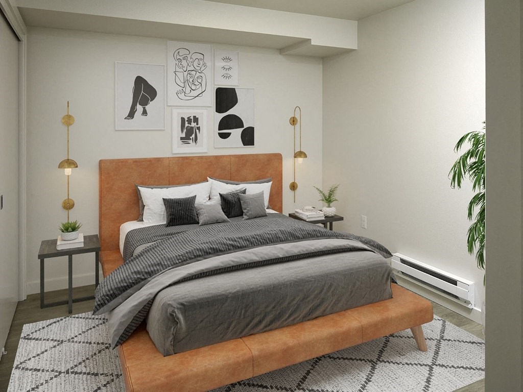 a bedroom with a bed and a rug