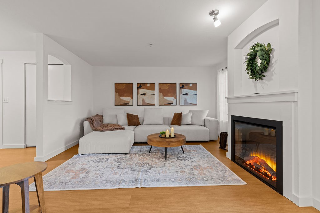 A living room with a fireplace and a couch.
